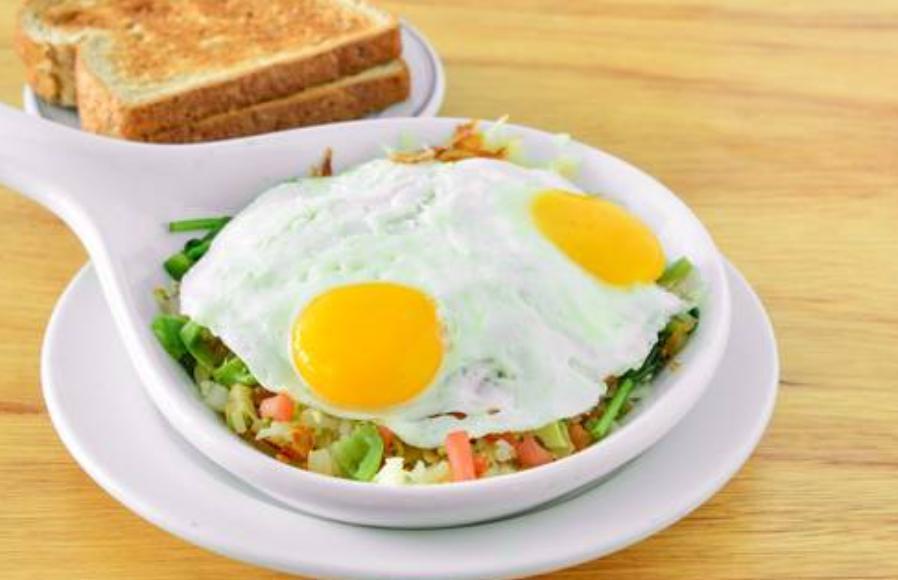 Tricolor Skillet · 2 egg skillet prepared over hash browns. Served with your choice of toast or pancakes. Tomato, onion, broccoli and American Cheese.