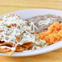 Chilaquiles · Fried tortillas with green or red salsa and topped with sour cream and cheese. Add egg, chic...
