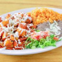 Enchiladas · 4 cheese enchiladas topped with sauteed carrots, potatoes, sour cream and queso fresco. Serv...