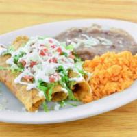 Flauta Dinner · 3 chicken flautas topped with lettuce, tomato, sour cream and queso fresco. Served with rice...