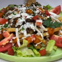 Shawarma Fries · Your choice of Shawarma Beef or Chicken added on top of French Fries, Tomato, Onion and Garn...