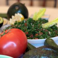 Tabbouleh · Our Tabbouleh made of finely chopped parsley, diced cucumber with tomatoes, mint, red onion,...