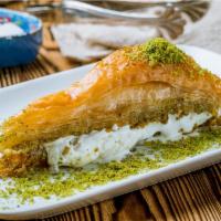 Triangle Baklava · Triangle Baklava is made with buttery thin layers of flaky dough and fresh ground pistachios...