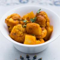 Aloo Gobhi · Potatoes, cauliflower florets, ginger, cumin.
