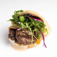 Kefta Pita  · Ground lamb and beef grilled over coals with tahina, amba, chopped salad, grilled onion and ...