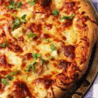 BBQ Chicken Tandoori Pizza · Tandoori chicken, BBQ sauce, onion, bell pepper, and cilantro.
