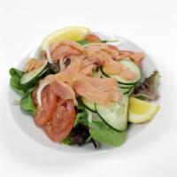 Salmon Salad · Mixed greens, smoked salmon, tomatoes, onions, cucumbers and lemon.