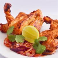 Tandoori Chicken (Half Chicken) · Chicken marinated in yogurt and spices.
