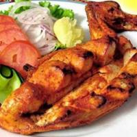 Chicken Tikka Breast · Bone-in chicken breast marinated in ginger, garlic, herbs, and spices.