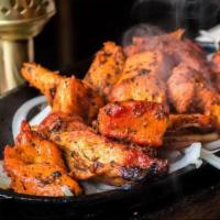 Chicken Tikka Boti Kebab (White Meat) · Boneless chicken breast cubes marinated in ginger, garlic, herbs, and spices