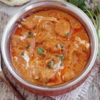 Murgh Makhani · Boneless chicken simmered in a mild creamy tomato sauce.