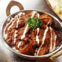 Lamb Vindaloo · Lamb curry with potatoes and herbs in a hot curry sauce.