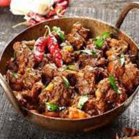 Karahi Gosht · Lamb cooked with butter, ginger, garlic, and spices in a semi-dry sauce.