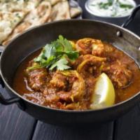 Prawn Vindaloo · Prawn and potatoes sautéed in a hot and spicy sauce.