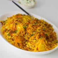 Chicken Biryani · Chicken with basmati rice, saffron, herbs, and spices.