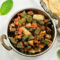 Bhindi Masala · Okra sauteed with bell peppers, onions, fresh tomatoes, and spices.