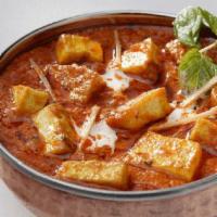 Paneer Tikka Masala · Homemade farmer’s cheese cooked in a creamy tomato sauce and fenugreek.