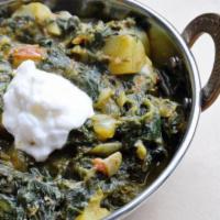 Palak Aloo  · Fresh spinach and potatoes cooked with onion, ginger, and garlic.