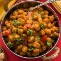 Chana Masala · Garbanzo beans with onions, fresh tomatoes, and spices north Indian style.