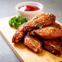 Chicken Wings · Choose a sauce. Add fries for an additional charge.