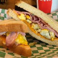 Breakfast Grilled Cheese · Fried or Scrambled Egg,  Black Forest Ham, Colby Cheddar & Tomatoes.  Grilled on Soft White ...