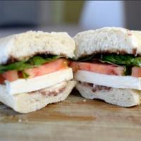 Caprese Sandwich · Fresh mozzarella, tomato and basil, dashed with balsamic vinegar and olive oil. Vegetarian.
