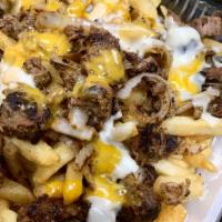 Steak Fries Platter · Hefty portion of french fries topped with juicy steak and melted cheese. Comes with sauce of...