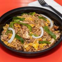 Jerk Chicken Fried Rice · Delicious combo of chicken, vegetables and rice