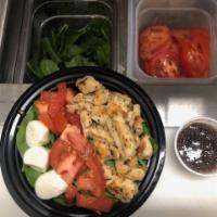 Chicken Caprese Salad  · Lemon pepper chicken, cherry tomatoes, mozzarella and spinach served with balsamic. 