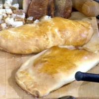 Individual Calzone with Cheese · A baked or fried turnover of pizza dough stuffed with savory fillings. 