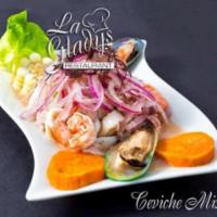 7. Ceviche Mixto · Peruvian style seafood marinated in lemon juice, served with potato and corn.