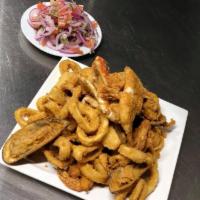 31. Jalea Familiar Family Size · Deep-fried seafood combination served with fried cassava (yuca).