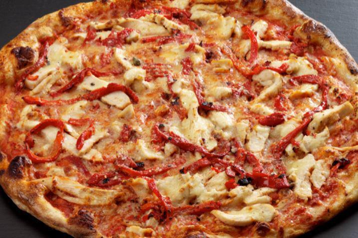 #28. Pollo Pesto Pizza · Our pesto recipe includes walnuts. Pesto sauce, grilled chicken breast, marinated tomatoes, ricotta, mozzarella cheese, garlic sauce and fresh basil.