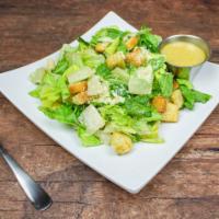 Caesar Salad · Crisp romaine lettuce with croutons and shredded Parmesan cheese. Served with our creamy Cae...