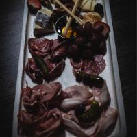 Deluxe Board · Parmesan, Camembert, tormage with truffles, Manchego, pancetta, coppa. Prosciutto, salametti...