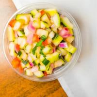 Cucumber Salad · Mixed greens, chopped cucumber, tomato, red onion with house dressing.