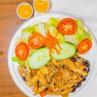 Chop Chop · Peruvian chicken stew served over rice and beans with side salad.