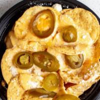 Tostinachos/nachos · Medium. Tostitos o chips, queso para nachos, jalapenos. Tostitos or chips nachos cheese, jal...