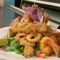 Jalea Mixta · The works, deep fried fish, calamari, muscles, prawns, Peruvian giant corn, garnished with J...