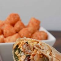 Veggie Trix · Eggs, tater tots, poblano peppers, onions, mushrooms and shredded cheddar jack cheese in a w...