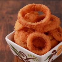 Onion Rings · Breaded thick cut onion rings, served crispy and golden-brown.