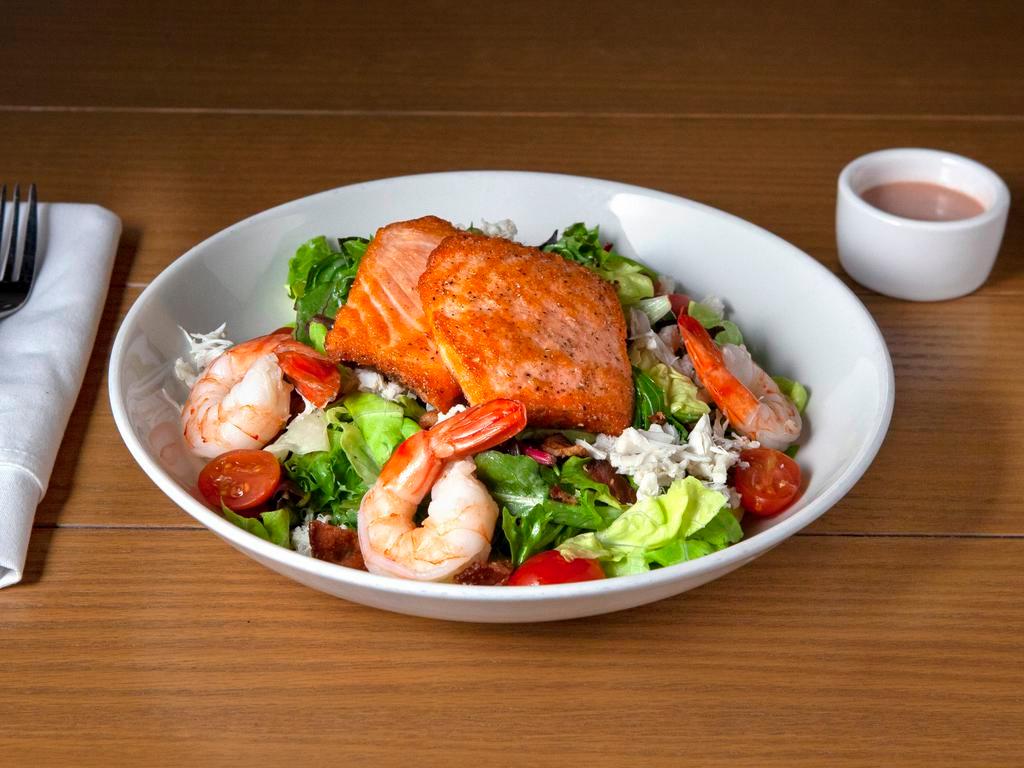 Seafood Cobb Salad Lunch · Mixed greens, lump crab, salmon medallion, Gulf shrimp, crispy bacon with ginger vinaigrette. So good.