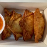 Crab Rangoon (4 pieces) · 4 Crab Rangoons with a sweet and sour dipping sauce 