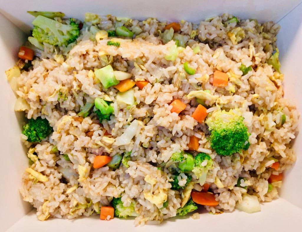 Veggie Fried Rice · Steamed fried rice mixed with veggies, including carrots and broccoli.
