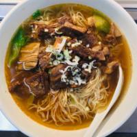 Braised Beef Brisket Noodle Soup · Egg noodles in a clear broth soup with lettuce, green onion, and Hong Kong style braised bee...