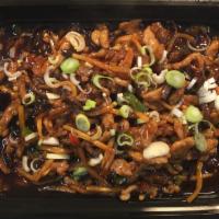 Sauteed Shredded Pork with Garlic Sauce · Tangy, spicy, sweet and sour dish with sautéed shredded pork, wooden ear mushrooms, and bamb...