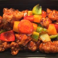 Sweet and Sour Pork · Deep fried pork stir fried with onion, bell pepper, and pineapple in a sweet and tangy sauce. 