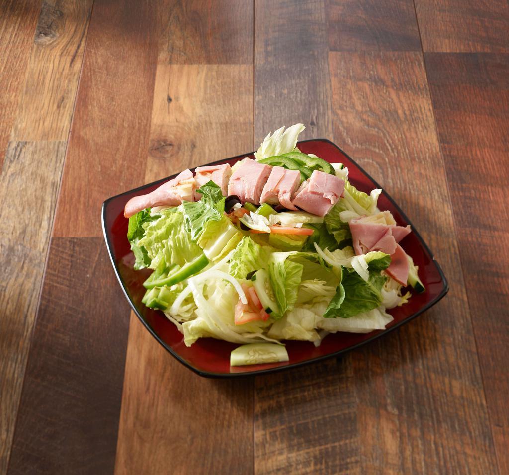 Chef Salad · Garden vegetable and black olives with turkey, ham and Swiss cheese.