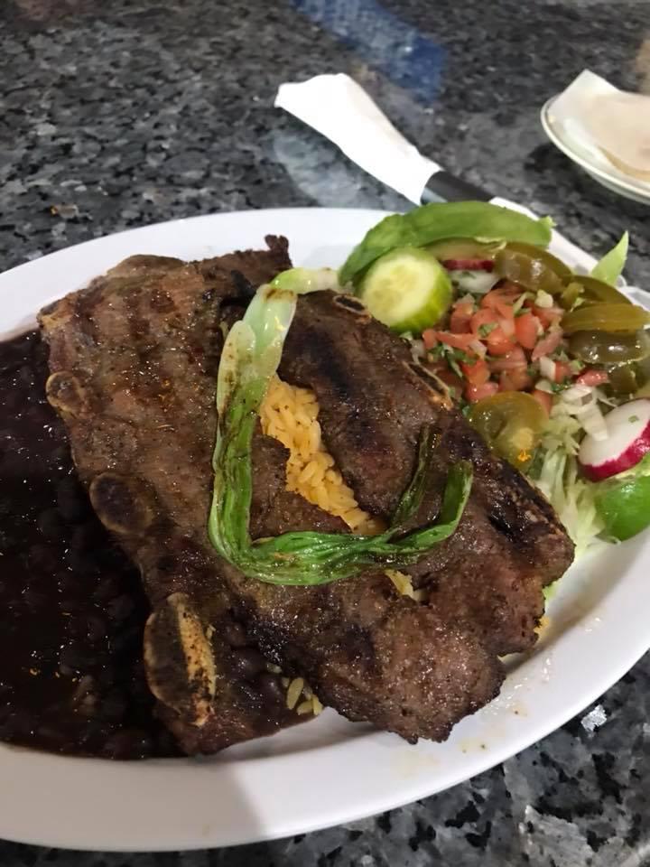 Costillas De Res  · two beef ribs seasoned and grilled to taste, served with rice, beans, salad and corn tortillas 