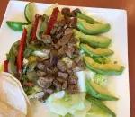 Steak Fajita Salad · Romaine lettuce, avocado, steak, fajita veggies with 2 corn tortillas.